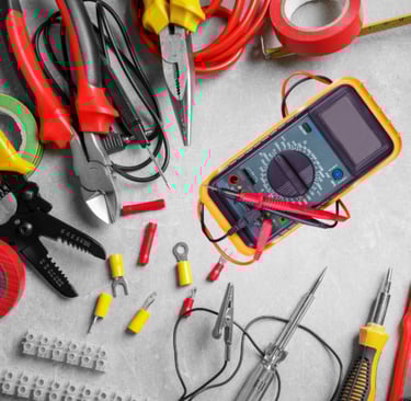 a bunch of electrical tools that are on a table