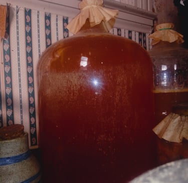 a large jug of fermenting cider