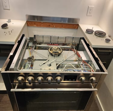 Stainless steel stove, top is removed for maintenance repair