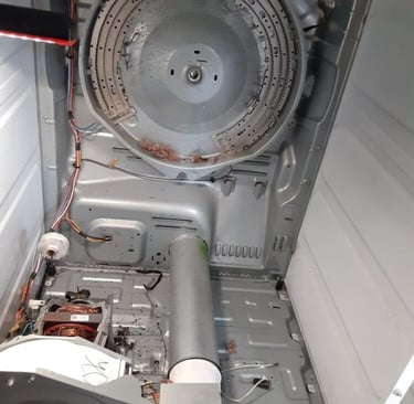 dryer taken a part and showing an exposed heating element