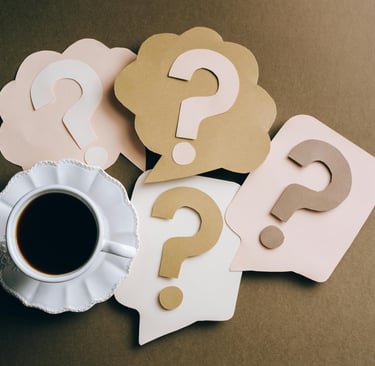a cup of coffee with question mark on it
