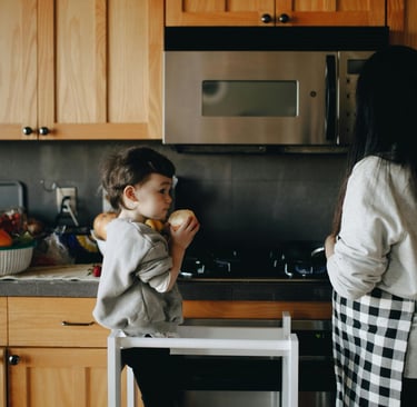 son helping mom in kitchen
