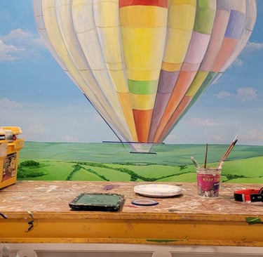 work setup in front of bespoke mural by artworks by marcine in warren, nj