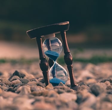 an hourglass indicating what to do when someone dies checklist