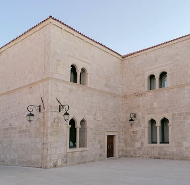 a building with a clock on the outside, how to get to Pag from Italy