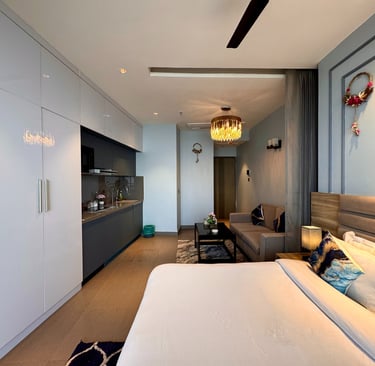 Room that has wardrobe kitchen appliancec