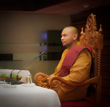 a monk monk in a chair with a microphone