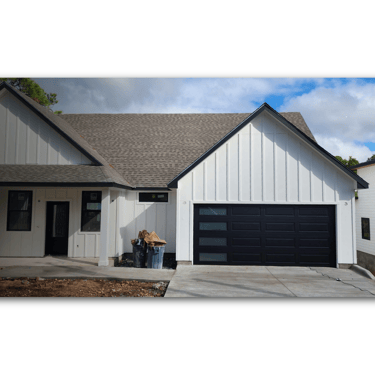 Custom black garage door with windows, Installed by On Point overhead doors In Austin TX