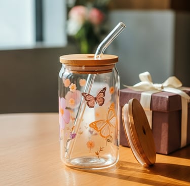 A glass tumbler with a straw and a straw in it