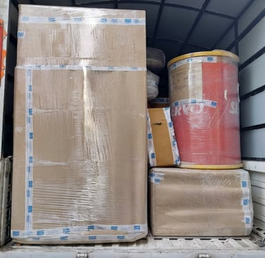 ''furniture being loaded into a truck, which is securely wrapped.'' 