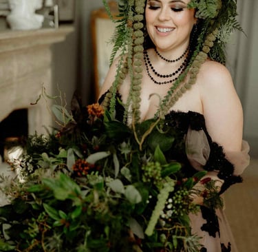 a woman in a dress with a deer antler headdress