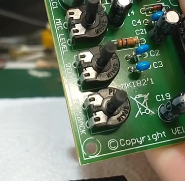Digital echo chamber kit. Inserting delay line IC.