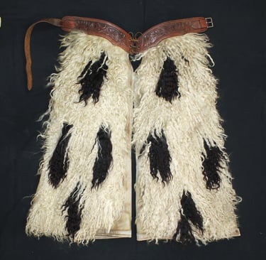 Rare, antique chaps with pinto pattern and long, twisted white hair. 
