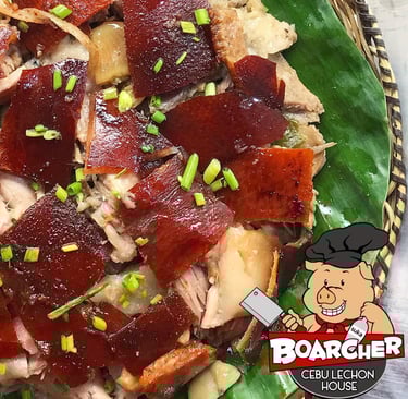 lechon on a banana leaf plate