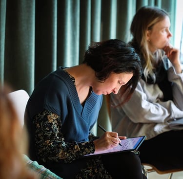 Me writing on my tablet in consultation with our project target croup people. 
