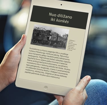 A man is holding a tablet and reading the book "90 Years on the Road", in a pdf format adapted for the visually impaired.