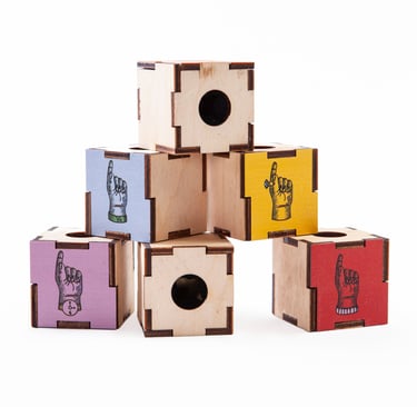 Colour boxes with hand illustrations and finger holes.