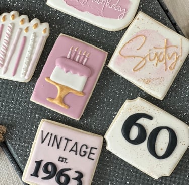 a number of cookies decorated with birthday candles