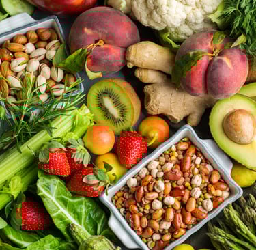 a variety of fruits and vegetables are displayed on a table