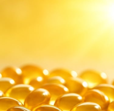 Soft-focus capsules of vitamin D illuminated by sunlight.