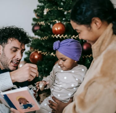 Parents reading book to child