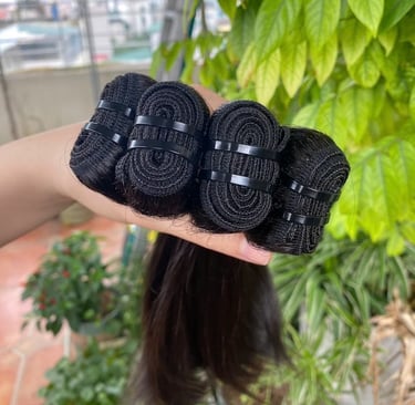 Close-up of machine weft bone straight Vietnamese hair with strong stitching