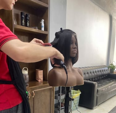Stylist finishing a Vietnamese human hair bob wig at Vietsilkhair.