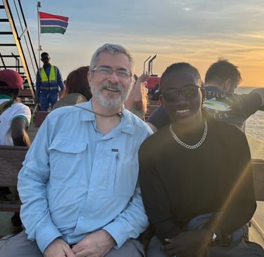 Stephanie's father and fiancé are aboard a ferry heading to Kunta Kinteh Island.