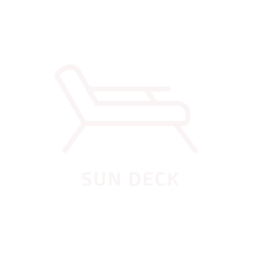 Private sun deck with loungers next to the villa’s pool, ideal for relaxation and tropical living