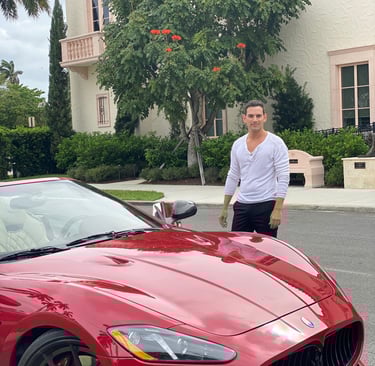 A red Maserati sports car, Rick Rockefeller-Silvia, in Nice, France. Polo Magazine 