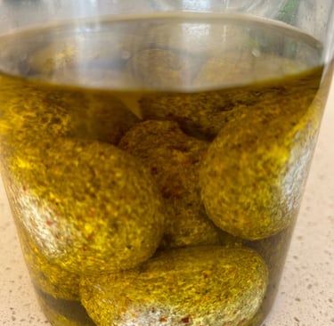 Labneh balls in a jar of olive oil