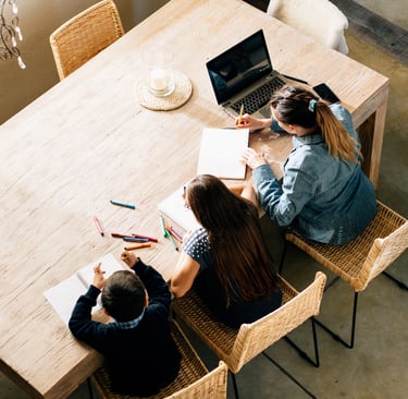 three children working together at a table