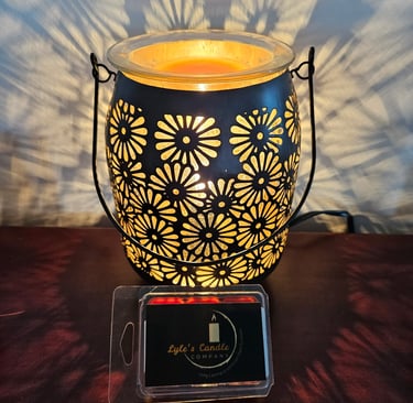 a candle lit up with a candle in a glass jar