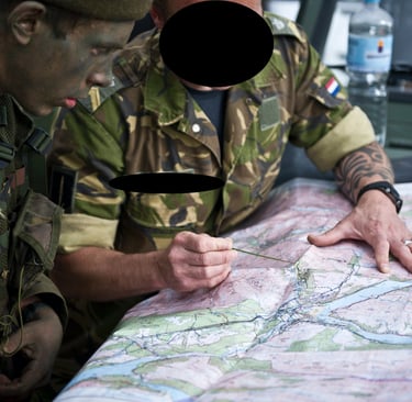 a man in uniform is looking at a map