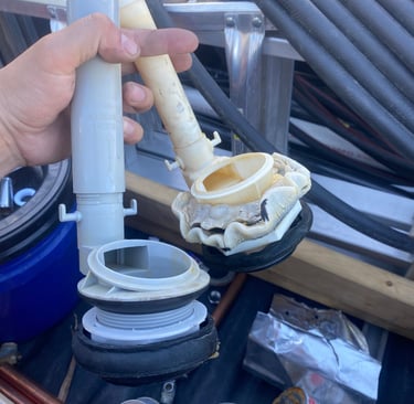 Worn out flush valve on the right compared to new one on the left