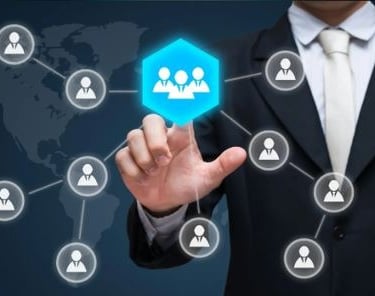 a person in a suit and tie with a blue hexagon of a CBI affiliate network