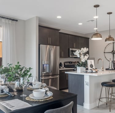a kitchen with a table and chairs and a table