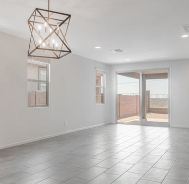 a room with a ceiling fan and a light fixture
