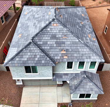 a house with a roof that has a roof that is covered in shinning