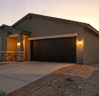 a house with a garage door and a driveway