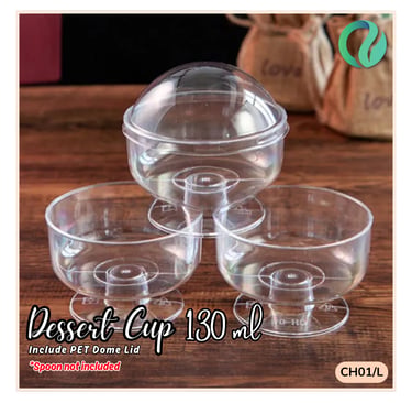 Clear 130ml plastic dessert cup with PET dome lid for parfaits and sweets on a wooden table.