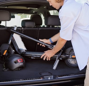 a man in a white shirt is holding a bike racket