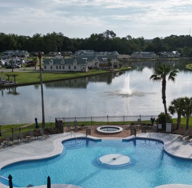 Resort ammenities and spring fed lake overlooking upsale community home and RV sites
