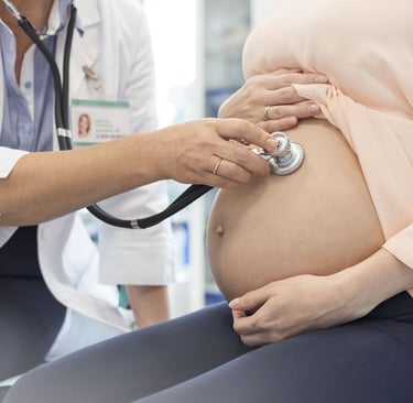Gynecologist checking patient
