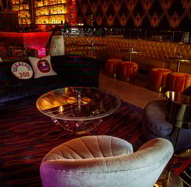 The Eighth Room lounge in Nashville with Gucci wallpaper, Versace furnishings, and Viation’s discree