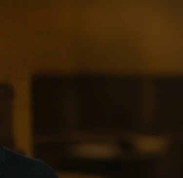 a man in a blue sweater with the brightworks services logo 