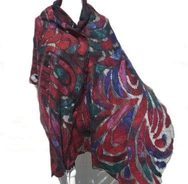 Handmade red and blue nuno felted wool scarf with an abstract swirl pattern on a mannequin.