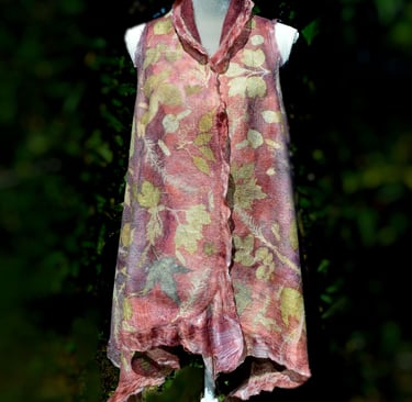 Handmade nuno felted vest with botanical leaf prints and ruffled edges displayed on a white mannequin.