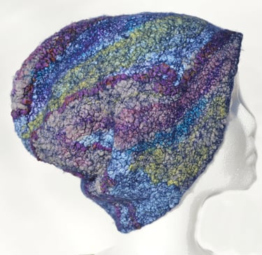 Handmade textured felt slouchy beanie hat in shades of blue, purple, and green silk embelishments