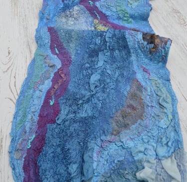 Handmade nuno felted wool scarf in blue and purple shades with textured silk ruffles.